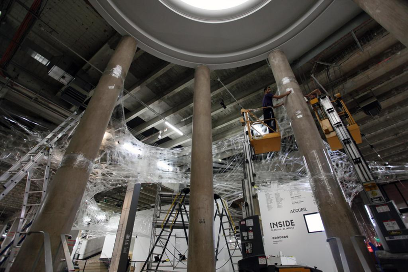 Illustration for article titled You Can Climb Through This Web Made From 27 Miles of Tape